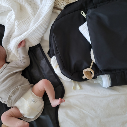 baby next to state bags lorimer diaper bag backpack