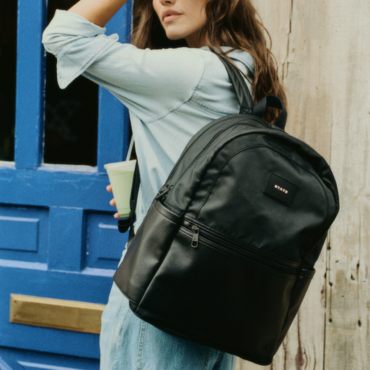 woman wearing STATE Bags Evan's Double Pocket Black