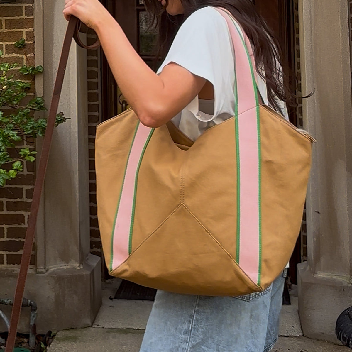 Woman wearing beverly tote canvas camel