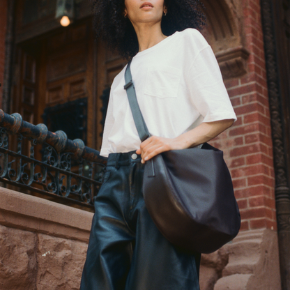 woman wearing state bags luna crossbody black