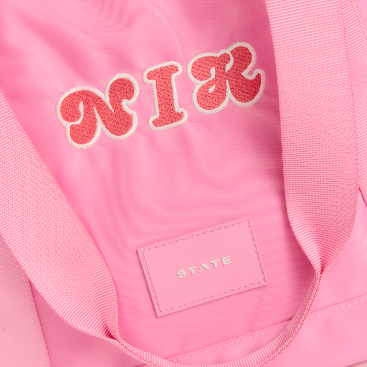 state bags graham totes in pink close up personalization