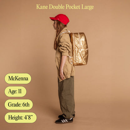 Girl wearing kane double pocket large with age, grade, and height